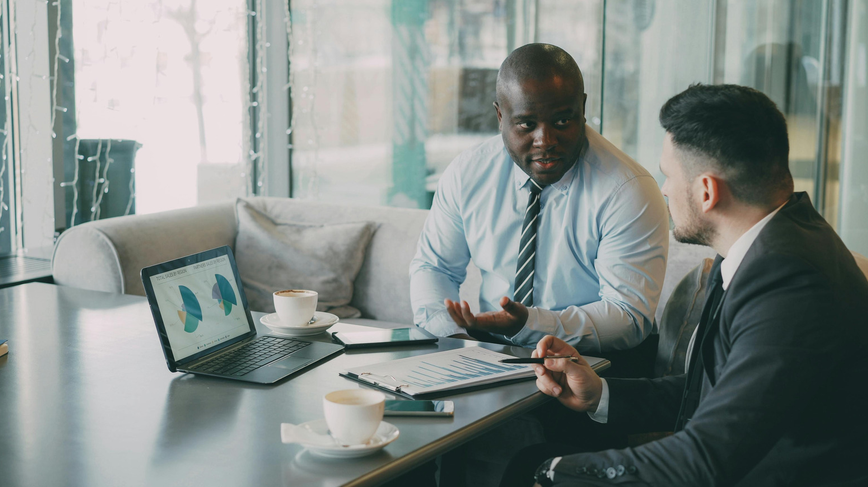 business coach at table with employee
